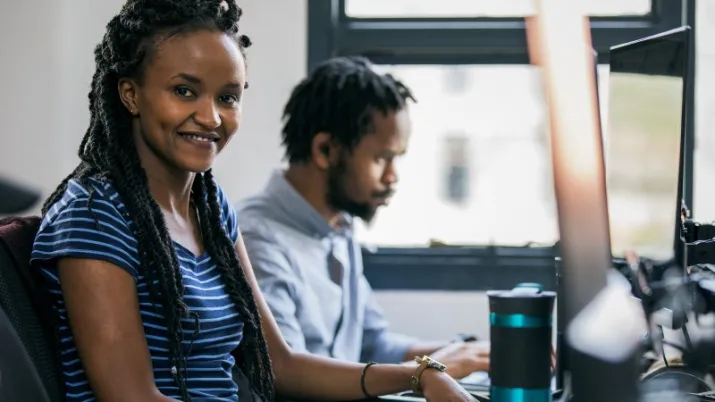 A woman working at a computer in Kenya